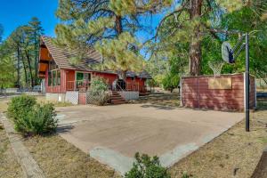 a red house with a driveway in front of it at Less Than 2 Mi to Dtwn Prescott Cabin with Furnished Deck in Prescott