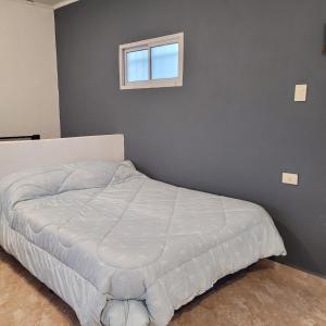 Ένα ή περισσότερα κρεβάτια σε δωμάτιο στο Departamento Reconquista - Perla del Norte +4 φωτογραφίες