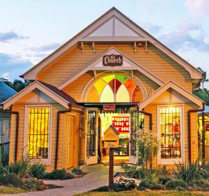 a store front of a building with a sign on it at The Old Church Maleny in Maleny