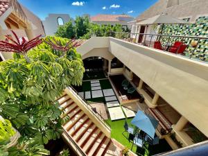 an overhead view of a balcony of a building with plants at Marisol Hotel Boutique in San José del Cabo