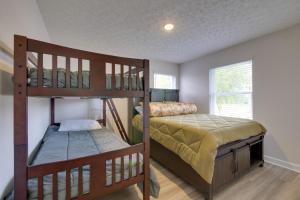 a bedroom with two bunk beds in a room at Hot Tub, Lake Access, and Dock Port Clinton Retreat in Port Clinton