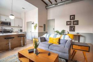 a living room with a couch and a table at Lovely Condo in Downtown Birmingham in Birmingham