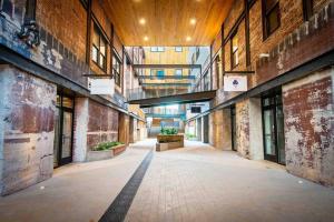 an empty alley in an old building with a wooden ceiling at Lovely Condo in Downtown Birmingham in Birmingham