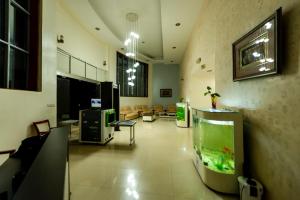 a lobby with a fish tank in a room at Dove Hotel Kigali in Kigali