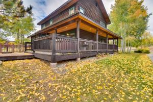 a home with a large deck and a house at Family-Friendly Steamboat Springs Home with Hot Tub! in Steamboat Springs