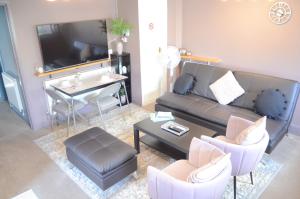 a living room with a couch and a table at The Annexe in Lydney