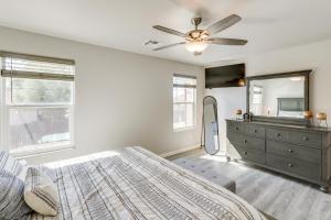 a bedroom with a bed and a dresser and a mirror at Private Patio and Fire Pit at Gold Canyon Getaway! in Gold Canyon