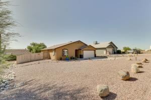 a house with a yard with rocks in front of it at Private Patio and Fire Pit at Gold Canyon Getaway! in Gold Canyon