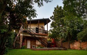 a house with a staircase leading up to it at Residencial Villalobos in Eldorado