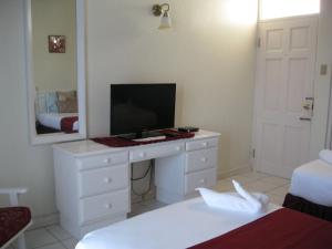 Letto o letti in una camera di Fisherman's Inn Hotel