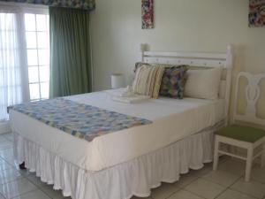 Letto o letti in una camera di Fisherman's Inn Hotel