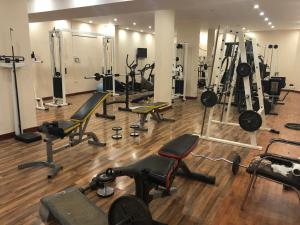 a gym with a bunch of exercise equipment in it at قمة البستان in Arar