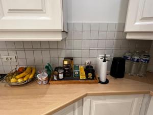 a kitchen counter with a tray of food on it at Eiffel Tower Oasis 30m from Eiffel Tower in Paris