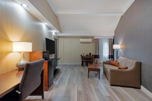 a living room with a couch and a table at Comfort Inn in Bangor