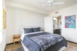 a bedroom with a bed and a ceiling fan at Brand New 2BR WeHo Luxury Apartment in Los Angeles
