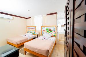 Rúm í herbergi á Franklyn D Resort & Spa All Inclusive