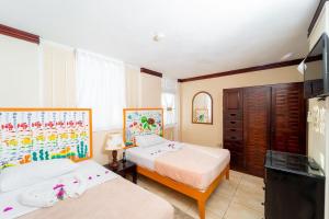 Rúm í herbergi á Franklyn D Resort & Spa All Inclusive