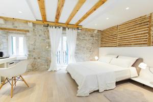Postel nebo postele na pokoji v ubytování Grgur Ninski Rooms