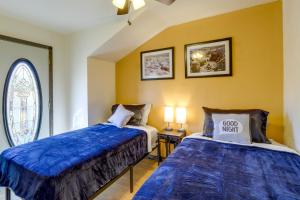 two beds sitting next to each other in a room at Family-Friendly Utah Home Deck, Mountain Views! in Vernal