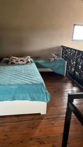 Una cama o camas en una habitación de Cambacuá Villa Rumipal