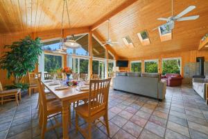 a dining room with a table and a couch at Captain's Hideaway in Nehalem