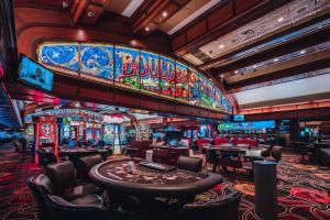 a casino with a bunch of slot machines and tables at Boulder Station Hotel & Casino in Las Vegas