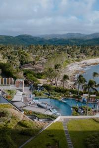 an aerial view of a resort with a beach at Turtle Bay Resort in Kahuku
