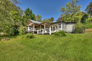 a house with a large yard in front of it at Mccaysville River House in McCaysville