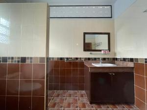 a bathroom with a sink and a mirror at Lanta Arrow House in Ko Lanta +32 photos