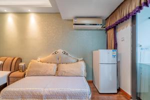Ένα ή περισσότερα κρεβάτια σε δωμάτιο στο Yue Ke Apartment - Changbin Road Branch