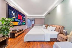 Ένα ή περισσότερα κρεβάτια σε δωμάτιο στο Yue Ke Apartment - Changbin Road Branch