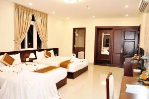 Ένα ή περισσότερα κρεβάτια σε δωμάτιο στο Sunview Beach Hotel Danang