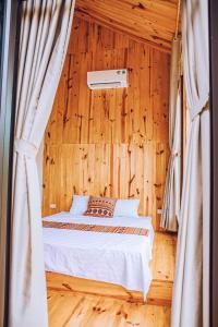 Łóżko lub łóżka w pokoju w obiekcie Chien's Lodge Du Gia