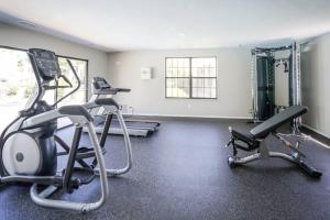 a gym with two treadmills and two exercise bikes at Cozy private getaway. Close to Convention Center and Medical Centers in Monroeville