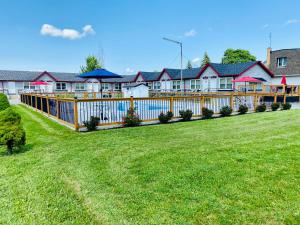 a fence in front of a row of houses at A1 Inn in Niagara Falls