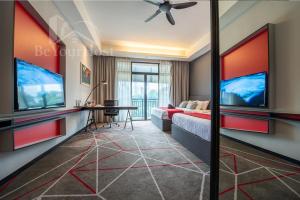 a living room with a bed and a tv at Maison 101 Dang Wangi Kuala Lumpur KLCC in Kuala Lumpur