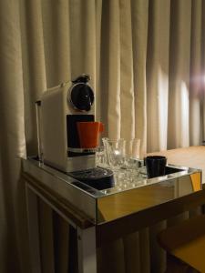 a microwave sitting on top of a counter at The Best Deluxe - Duplex Studio - Hotel Slav Moema - by LuXXoR in Sao Paulo