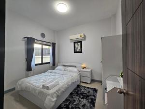 En eller flere senge i et værelse på We house - Hangdong