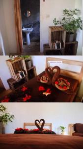 two pictures of a bedroom with two hearts on a table at Jambiani Café & Bungalow in Jambiani