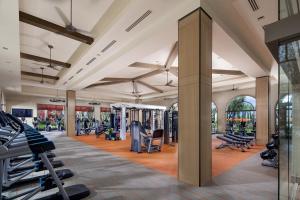 a gym with treadmills and exercise equipment in a building at Irvine Spectrum/2 Bedrooms/2 Bathrooms/Apartment/pool/gym in Irvine