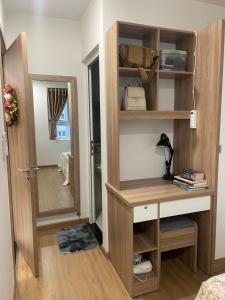 a room with a wooden desk and a mirror at SNOW`S HOUSE in Ho Chi Minh City