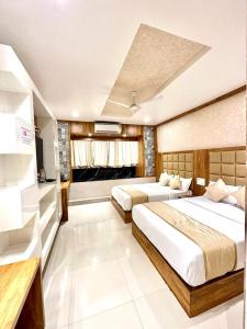 Postel nebo postele na pokoji v ubytování Hotel BKC Prime Near Trade Centre US Embassy, Mumbai