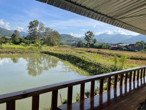a view of a river from a balcony at มองภู โฮมสเตย์ in Ban Fang