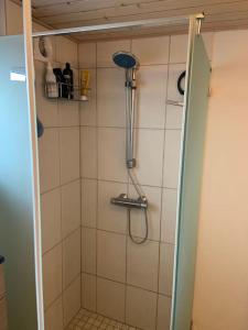 a bathroom with a shower with a shower at Happy Fisherman BnB in Aalborg