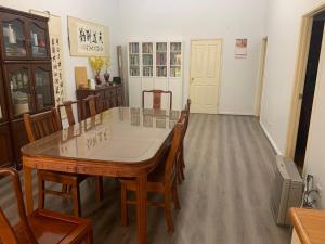 a dining room with a table and chairs at Double room share bathroom and kitchen in Perth