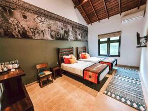 Llit o llits en una habitació de Serendib Signature Resort