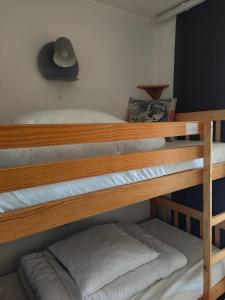 a couple of bunk beds in a room at Studio avec jardin et garage, à 100m d'une piste in Les Deux Alpes