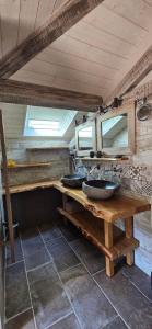 a bathroom with two sinks on a wooden table at Locagites82 in Moissac +36 photos