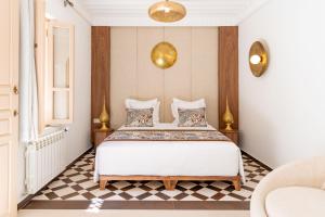 Postel nebo postele na pokoji v ubytování Riad Nyla Wellness and Spa