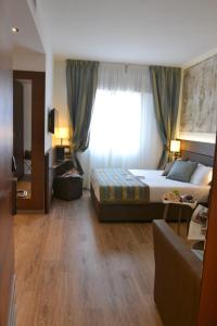 Posteľ alebo postele v izbe v ubytovaní LH Hotel Sirio Venice